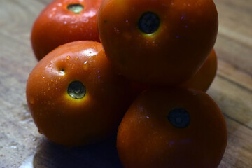 fresh red tamatos on table close up