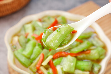 Stir-Fried Squash and Vegetables in Bowl with Wooden Spoon - Healthy Asian Cooking