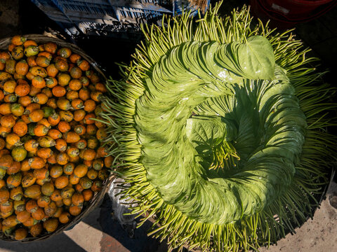 Abundant Display of Betel Leaves (Paan) and Areca Nuts (Supari) at a Local Market Stall