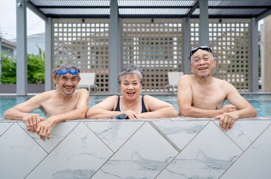 senior asian people enjoy summer vacation happy retirement, active adult exercising physical therapy at sport club swimming pool, elderly man travel with friends wellness life healthy lifestyle - Powered by Adobe
