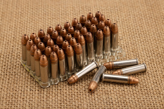Hollow-point .22 LR bullets , Close up of .22 ammunition on burlap background