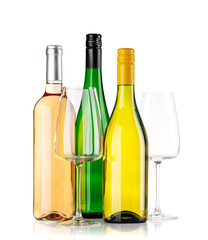 Naklejka premium Different wine bottles and glasses on white background