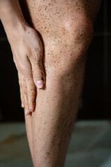 Coffee body scrub on female legs