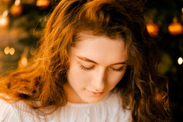 cozy room decorated for the new year and christmas. brick wall with retro lamps, loft style