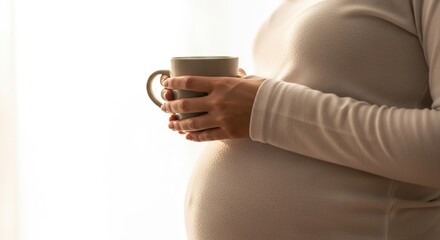 Pregnant woman drinking tea pregnancy health wellness maternity lifestyle expecting mother motherhood wellbeing