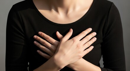 Woman with chest pain holding breast feeling for lump or heart attack symptom health awareness campaign