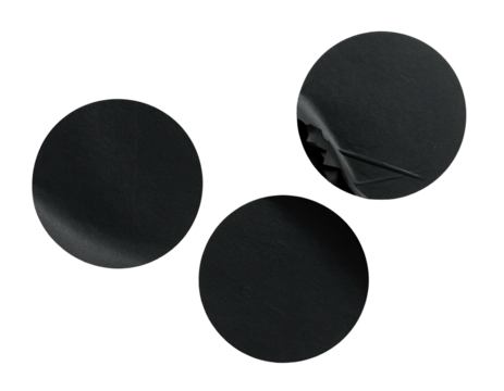 Three black circles, one partially peeled