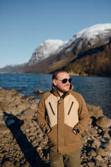 Man in Sunglasses by Mountain Lake