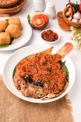 Indonesian Grilled Fish with Spicy Chili Sauce, Served with Fried Tofu.