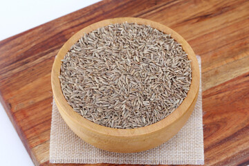 Fresh cumin seeds in wooden bowl ,Close up