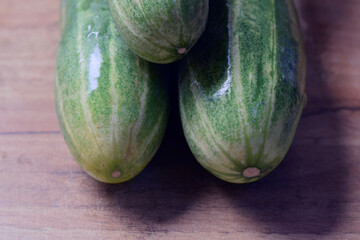 fresh green cucumber on table close up