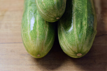 fresh green cucumber on table close up