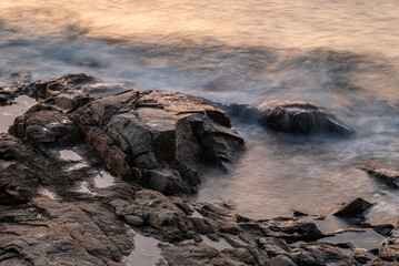 Serene Rocky Shoreline at Sunset