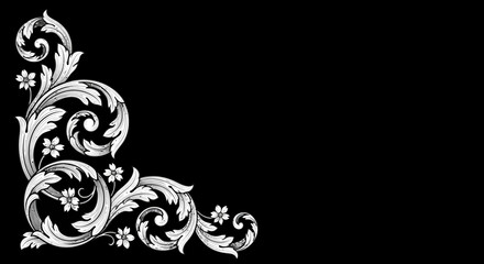 Ornate floral corner design in white on a black background.