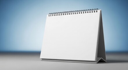 Blank spiral notebook template for calendar notes on an office desk