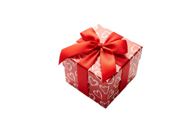 Obraz premium A red gift box with a ribbon and bow, decorated with hearts