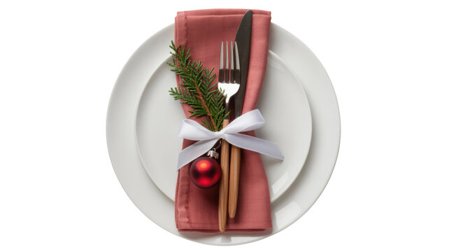 Elegant christmas table setting with a white oval plate and rose napkin tied with ribbon and festive greenery isolated on transparent background