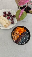 Colourful and delicious acai fruity breakfast bowl with toppings
