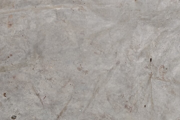 Subtle abstract textured background with soft pastel hues and delicate mottled patterns