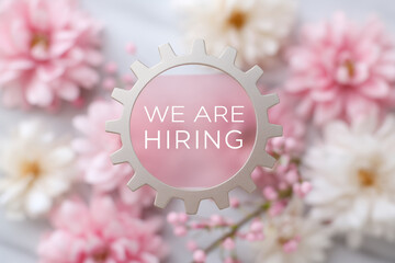 Innovative hiring announcement with creative gear design surrounded by flowers for a refreshing job opportunity
