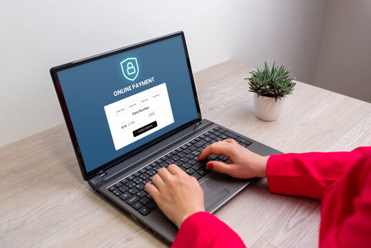 Hands typing on laptop showing online payment form with credit card fields, concept of digital transaction, secure finance, and e-commerce technology - Powered by Adobe