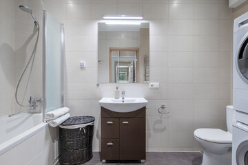 Modern Bright Home Bathroom Interior with Bathtub and Sink in Minimalist Style