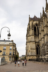 Reims, Marne, Grand-Est, France, August, 28th, 2025, Champagne Area, Visitors admire intricate carvings at sunset, Charming town square showcases majestic Gothic face among aged stone