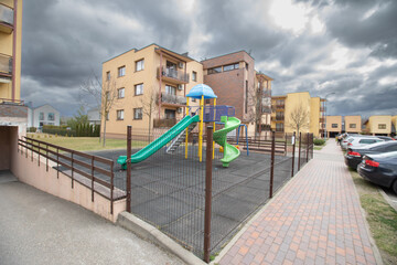 Urban Playground Area in Residential Neighborhood Surrounded by Modern Apartment Buildings