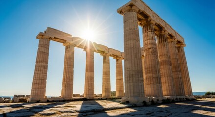 Ancient greek temple ruins with sunlight and blue sky. Historic architecture of Poseidon Temple at Cape Sounion. Historical landmark.
