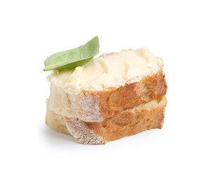 Slices of baguette with butter and basil isolated on white