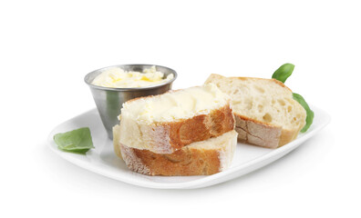 Slices of baguette with butter and basil isolated on white
