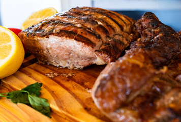 Horizontla close- up of various cuts of grilled meat ready to eat, creating a tempting and...