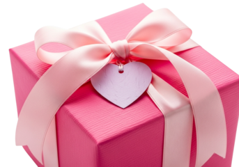 Pink gift box with a pink ribbon and a heartshaped tag