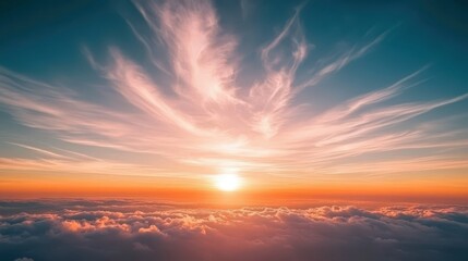 Obraz premium Beautiful Sunset Displaying Orange and Pink Hues Above the Clouds