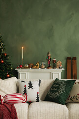 Festive living room with a decorated Christmas mantel, nutcrackers, and cozy cushions creating a warm holiday atmosphere.