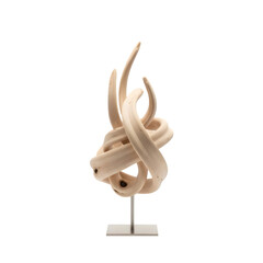 Abstract wooden sculpture on a stand with a black background showcasing intricate curves and organic shapes in natural light