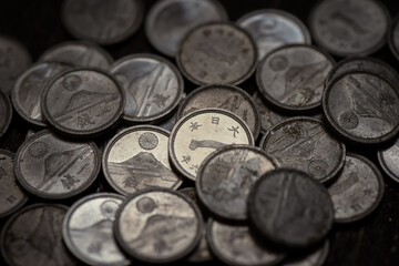 Ancient japanese coins old one sen coins scattered evoke a rich historical japanese currency surface. © Mr