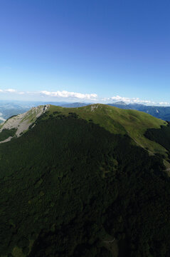 Aerial view of Mount Ventasso as seen from Mount Cusna. Tosco Emiliano Apennine ridge. Cerreto Laghi, Reggio Emilia, Emilia Romagna, Italy