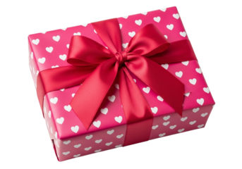 A pink gift box with white hearts and a red ribbon bow