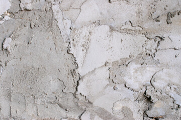 Close up photo of a concrete wall. Gray putty background.