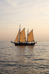 Sailing Boat on Lake Garda at Sunset