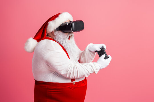 Santa in a VR headset plays a festive game with controller in a bright pink studio Christmas vibe