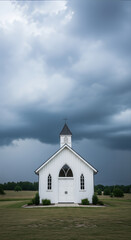 Country church stands against sky in rural landscape