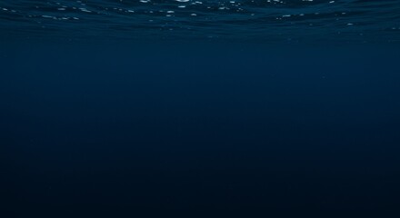 Sunlight pierces through the water surface creating rippling caustics above a sandy ocean floor in a tranquil underwater scene. This looping animation serves as a serene background for marine or relax