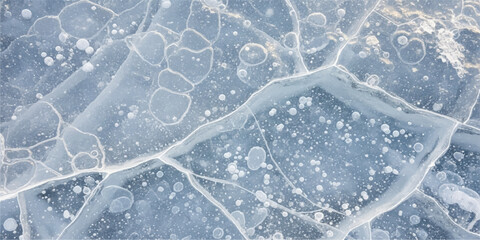 Abstract white and blue frost pattern on a window texture, featuring bright crystal snowflakes of the cold winter season
