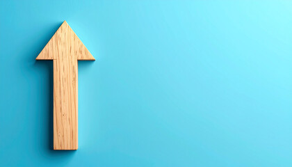 Minimalist wooden arrow pointing upward on blue background. Forward direction and progress