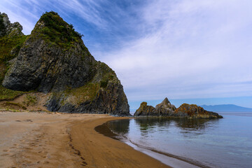 Explore the serene coastline of Russia with towering cliffs and tranquil waters