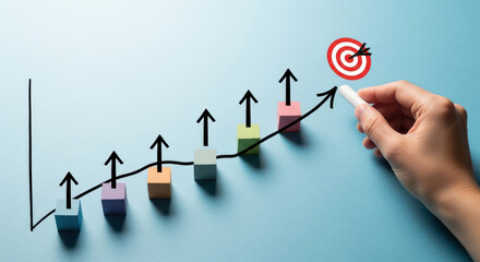 Hand drawing upward trend graph with target goal.