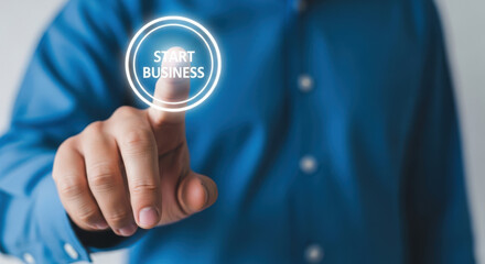 Hand Touching Glowing Start Business Button.