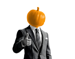 Surreal halloween head in a suit offering approval with thumbs up conveys positive feedback for october seasonal events and harvest festival
